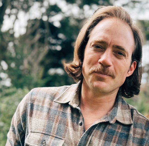 Portrait of TJ Pettit, founder of Evergreen Chronicles